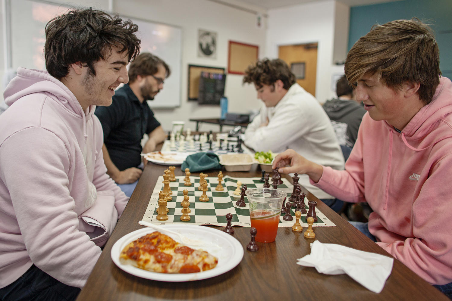 Spencer B. '20, left, plays against Ben M. '21 during Chess Club, which he forme