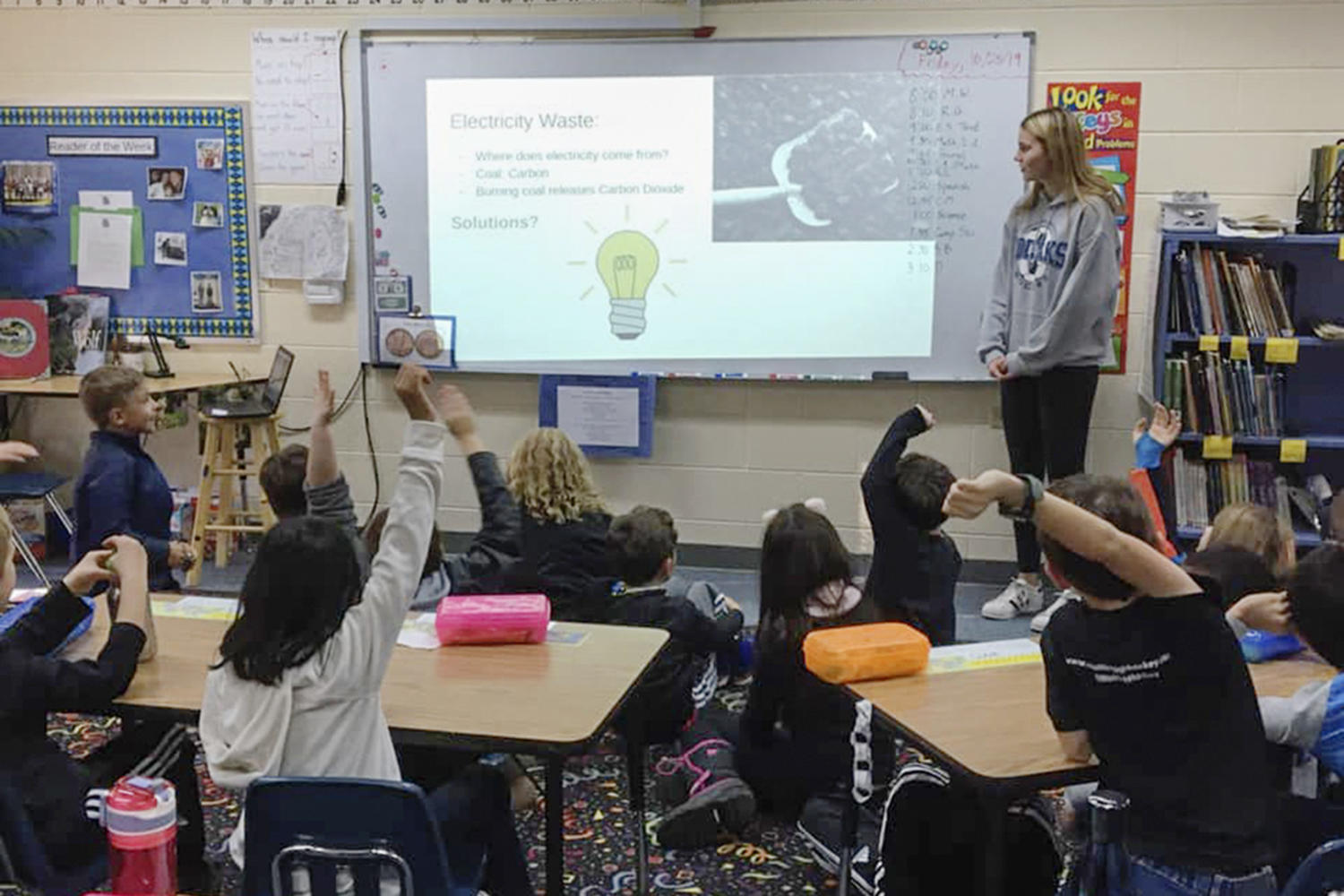 Green Team member Heather H. '21 speaks to 3rd graders about about sustainabilit