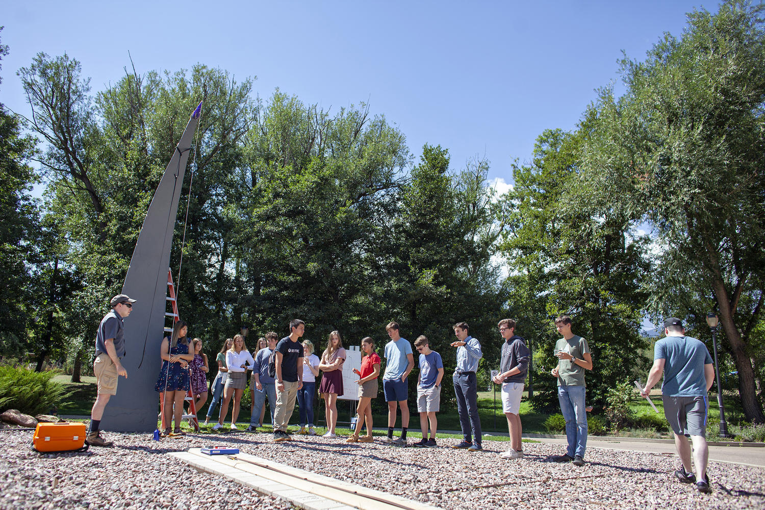 Upper School students prepare to measure the height from the ground to the sundi