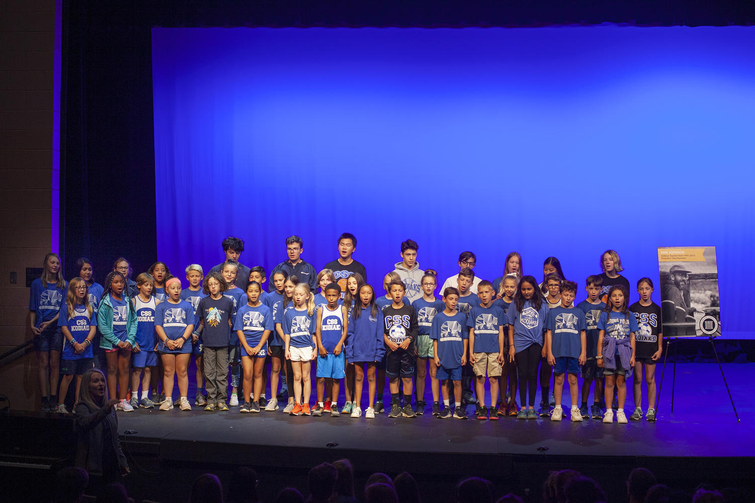 Vocal Ensemble and 5th graders sing together.