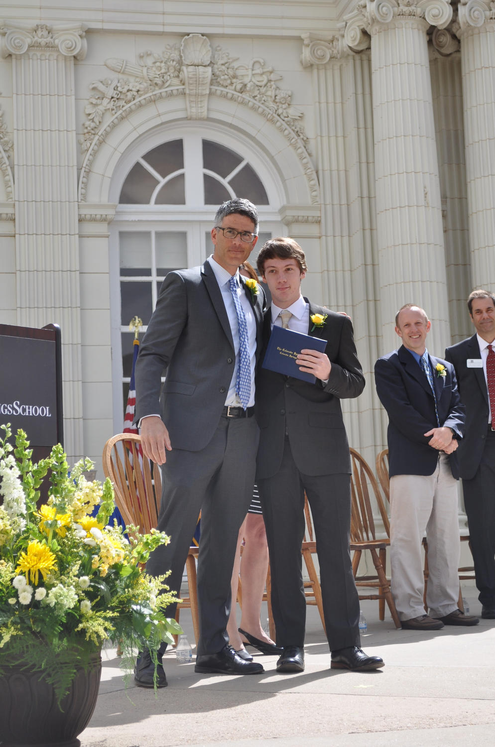 Mr. Schubach presents Geddy Marple '16 with his diploma.